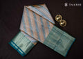Full length front view model drape photograph of Taashi The Copper Rhythm saree (PKJ08) in premium Bronze Copper & Gold Shot Kanjeevaram fabric layout.